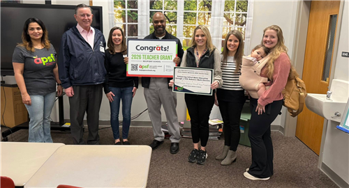 Ms. Oxendine and Mr. Ferrell with the Sinders Family at grant presentation.