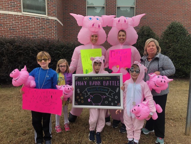 Parents and students in carpool raising money for the school