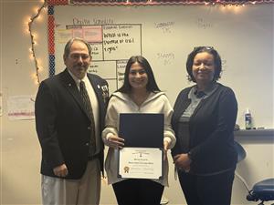 Sons of American Revolution representative,  Ms. Cocoran, and Assistant Principal Ms. Byrd-Robinson pose together.