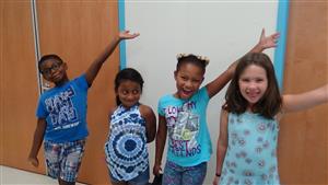 photo of students smiling and wearing blue 