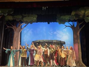 A scene with most of the actors