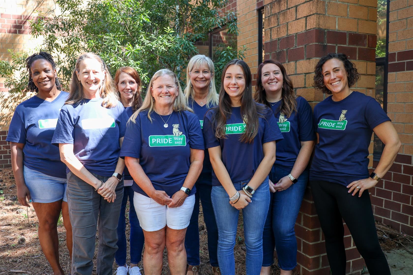 1st Grade Team members posing with their LES Pride shirts