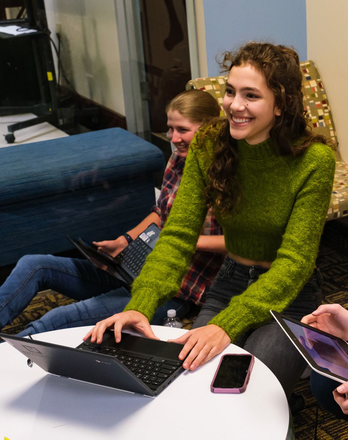  smiling girl using laptop