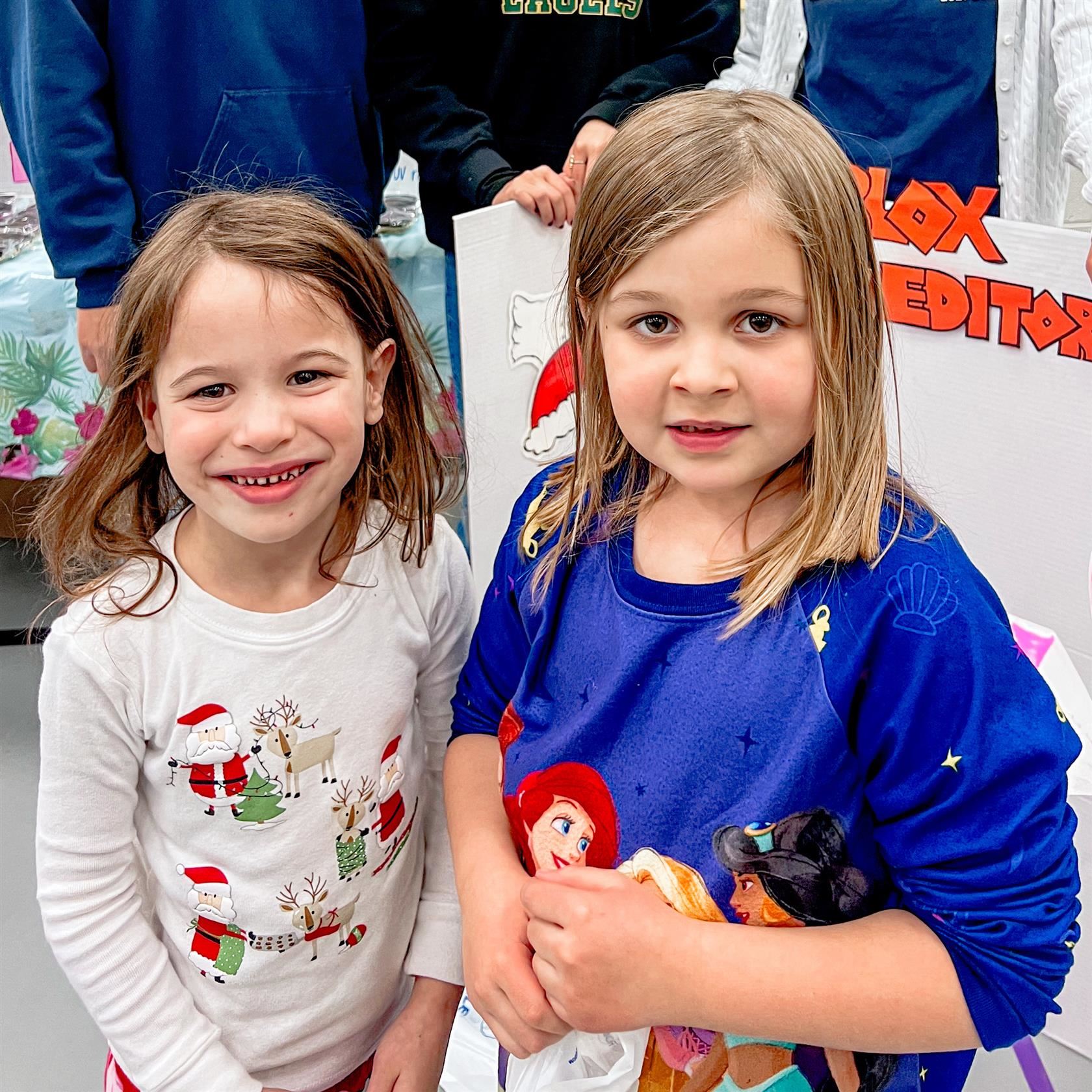  Two students smile for the camera