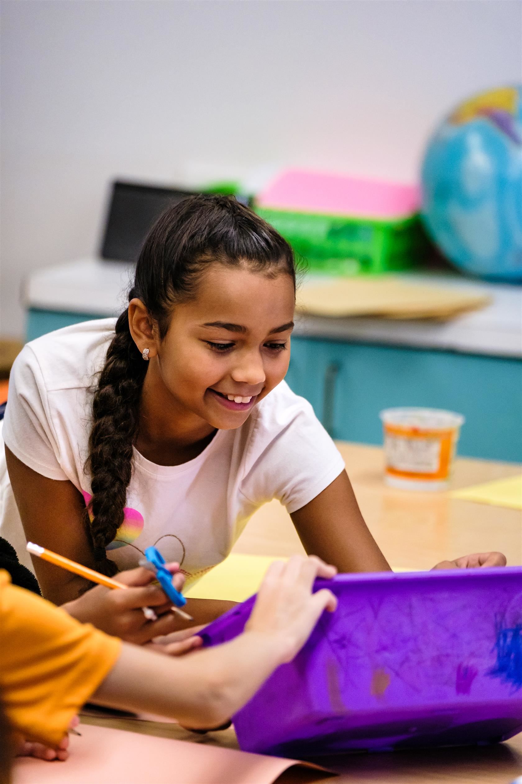  Girl smiling in art class.