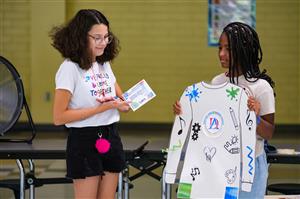 Two girls presenting a project