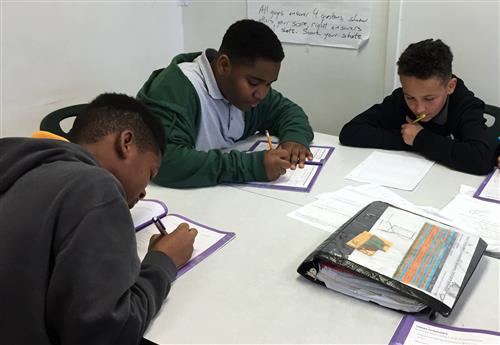 Middle School students working on math. 