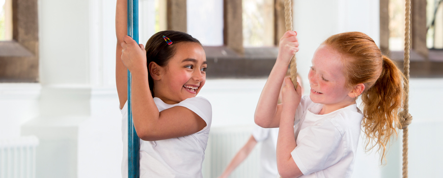 Image of girls climbing rope