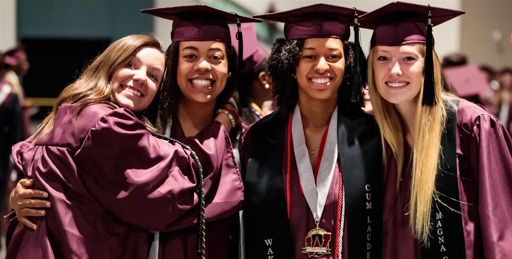 graduates smiling