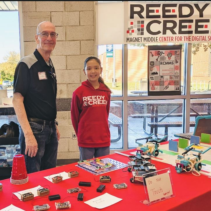  Mr. Boehm and Robotics student, Alina, at Magnet Mair