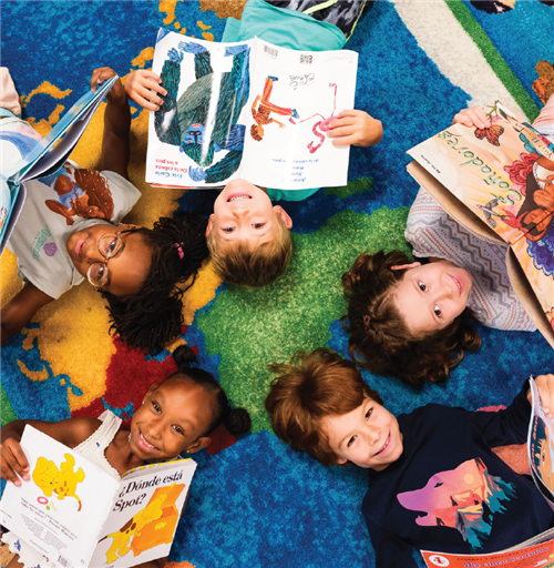 students reading Spanish books