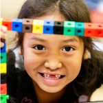  smiling child with blocks