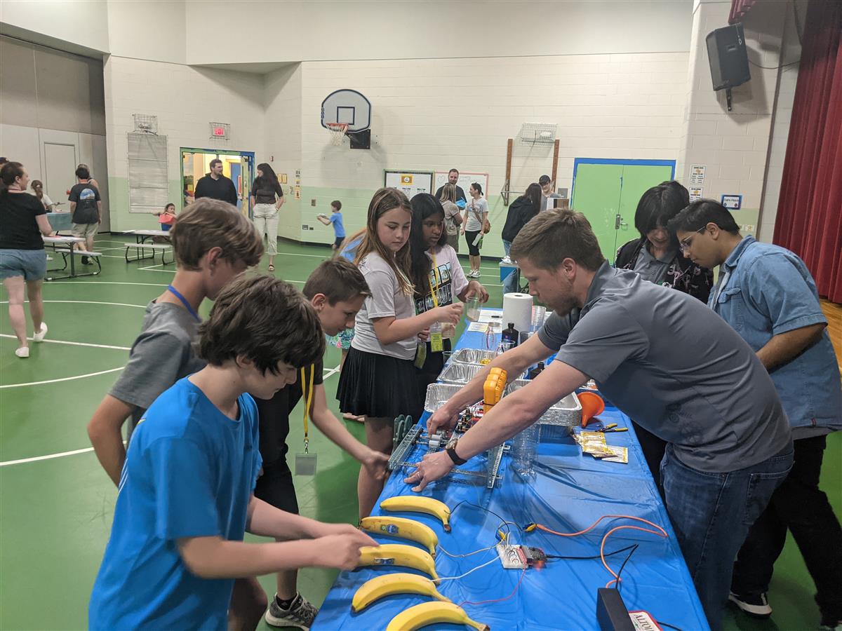 Mr. Westhafer demonstrates a banana piano at the Oak Grove STEAM Fair