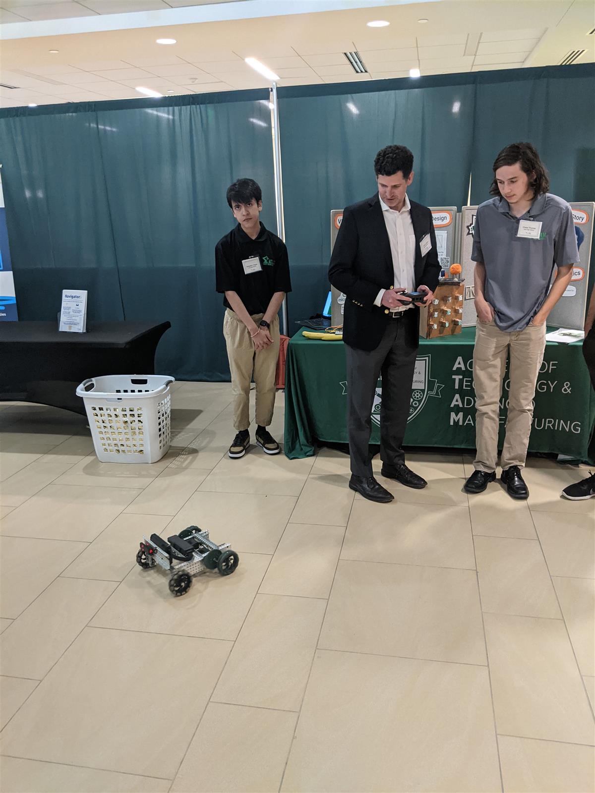 Mr. Lattimer using the ATAM robot at NCBCE 40th celebration