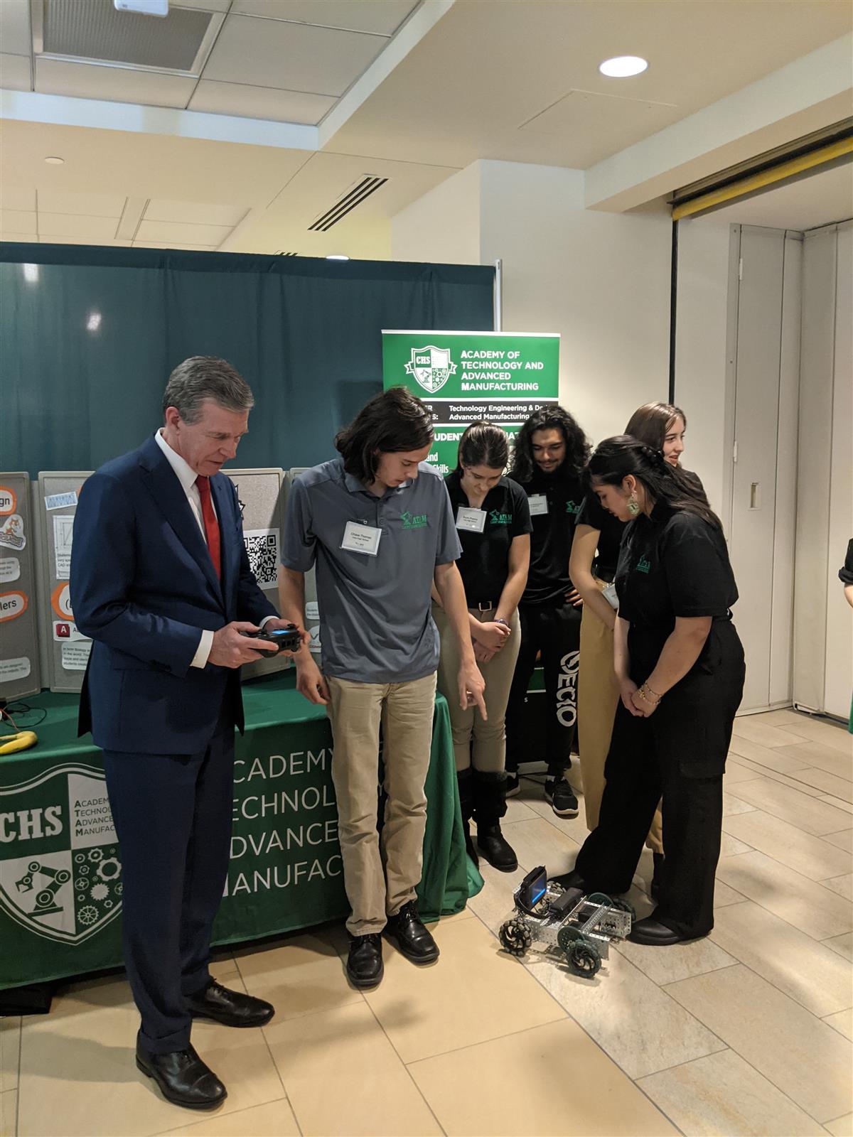 ATAM Students Showing the Robot to Governor Cooper