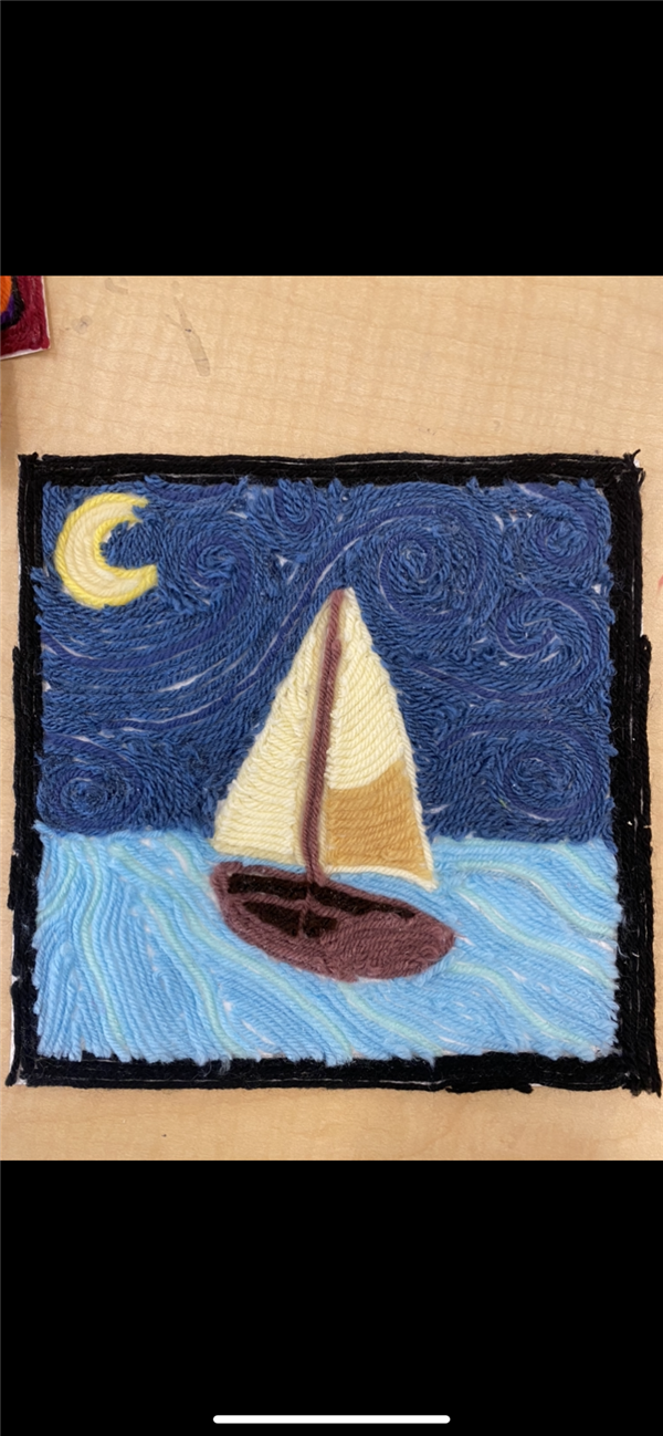 A yarn artwork of a sailboat and moon. 